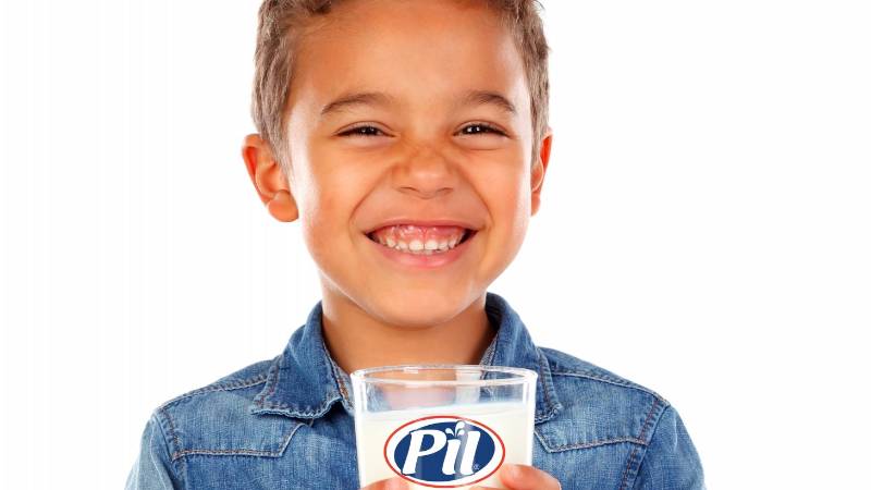 Adorable child drinking milk isolated on a white background Adorable child drinking milk isolated on a white background