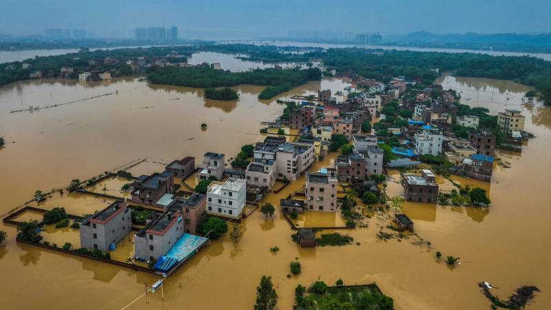 This aerial photograph taken on April 22, 2024 shows flooded buildings and streets after heavy rains in Qingyuan, in southern China's Guangdong province. - More than 100,000 people have been evacuated due to heavy rain and fatal floods in southern China, with the government issuing its highest-level rainstorm warning for the affected area on April 23. (Photo by AFP) / China OUT / CHINA OUT